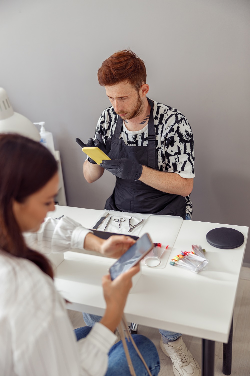 Busy woman client visiting modern manicure salon